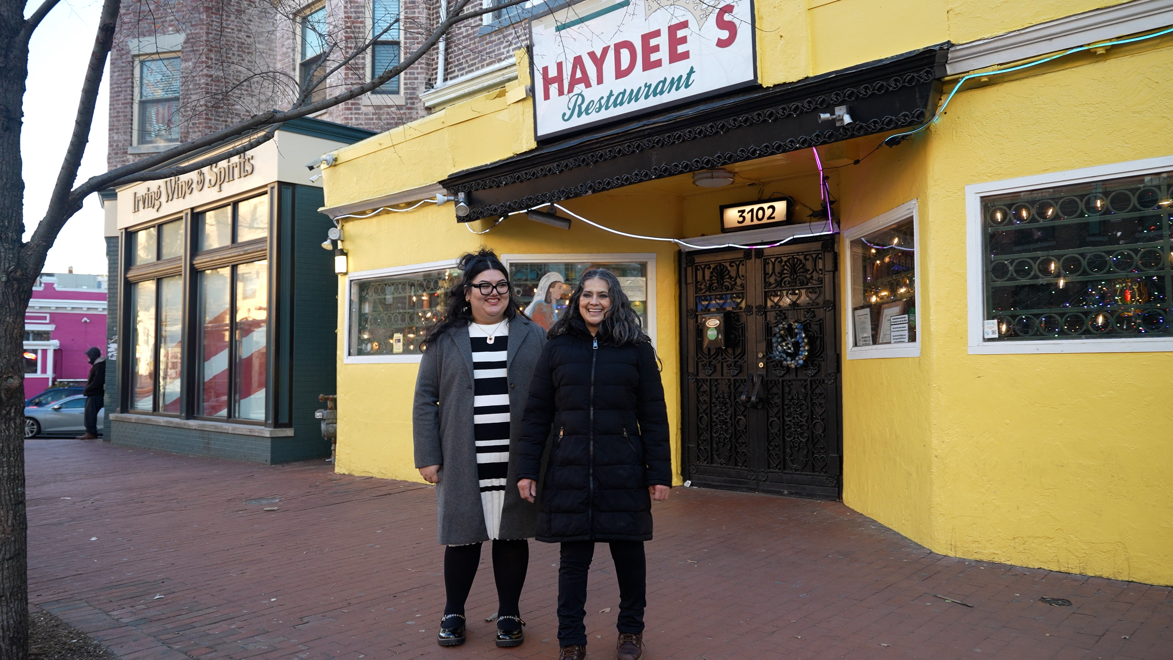 Haydee Vanegas and daughter Mary standing in front of Haydee's Restaurant
